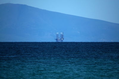 Scenic view of sea against sky and oil ring