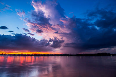 Scenic view of sea against romantic sky at sunset