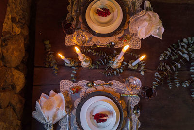 High angle view of table setting with candles