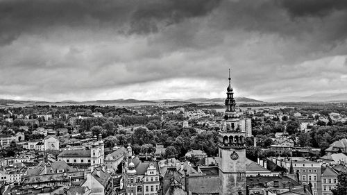 Buildings against cloudy sky