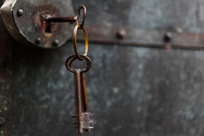 Close-up of key hanging in door