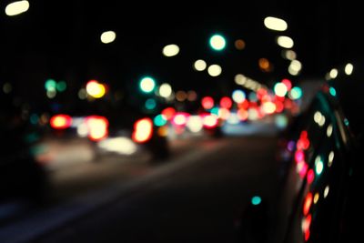 Defocused image of car on road at night