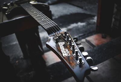 Close-up of hand playing guitar