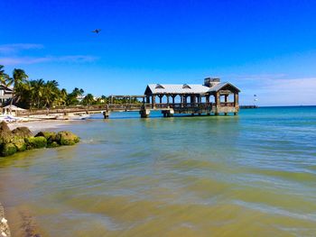 Scenic view of sea against blue sky