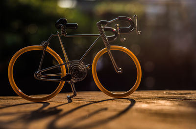 Close-up of small bicycle on table