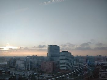 Cityscape against sky during sunset