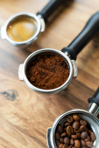 Different processes of preparing coffee by a barista in a coffee shop. coffee beans, ground, ready