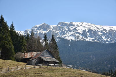 Scenic view of snowcapped mountains against clear sky