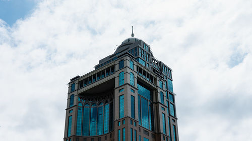 Low angle view of clock tower against sky