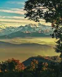 Scenic view of mountains against sky at sunset