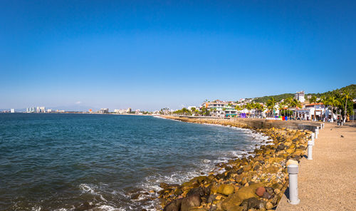 Scenic view of sea against clear blue sky