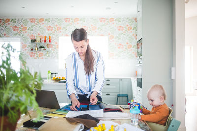 Woman with son on table