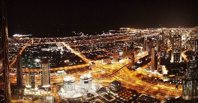 cityscape, city, architecture, illuminated, building exterior, built structure, night, crowded, high angle view, aerial view, skyscraper, residential district, city life, modern, capital cities, residential building, travel destinations, sky, no people, residential structure
