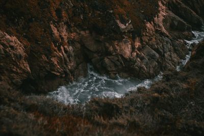 Close-up of rock formation in sea