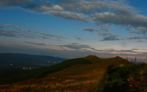 Scenic view of landscape against sky at sunset