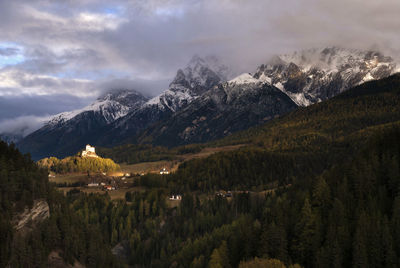 Panoramic view of trees and mountains against sky