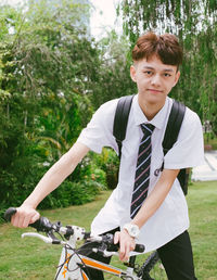 Portrait of young man on bicycle