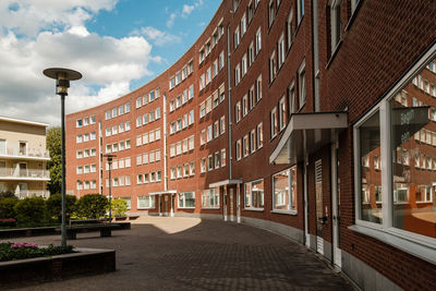 Street amidst buildings against sky