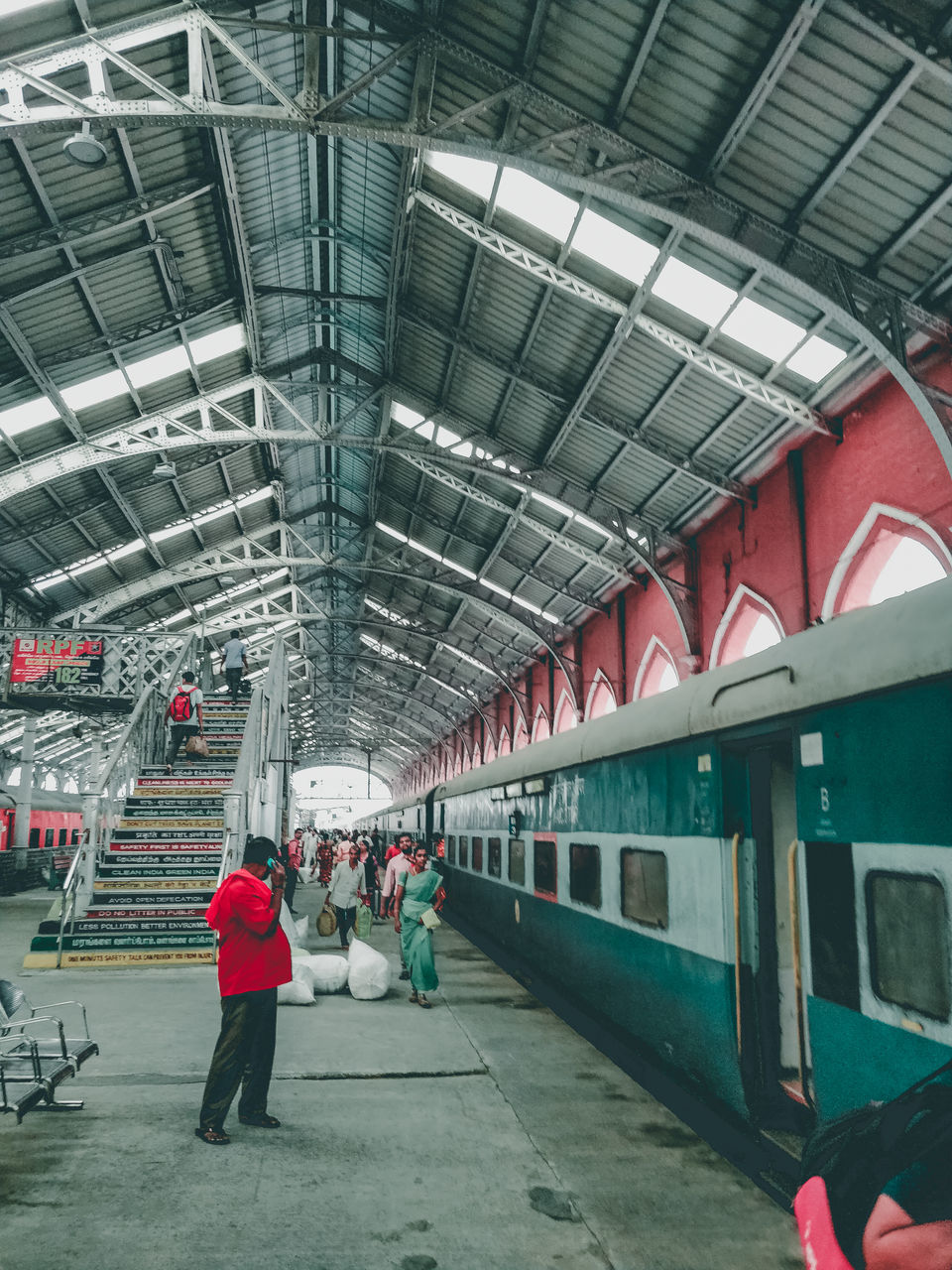 PEOPLE WAITING AT RAILROAD STATION