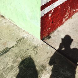 Shadow of people on wall