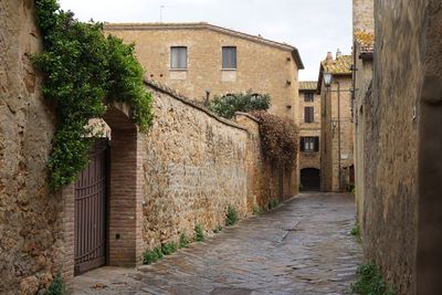 Alley amidst buildings in city