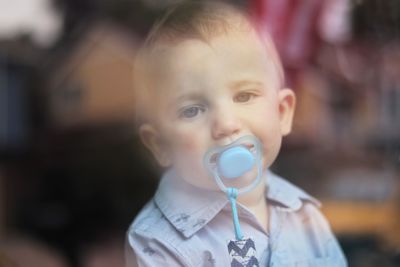 Portrait of cute baby boy looking away outdoors