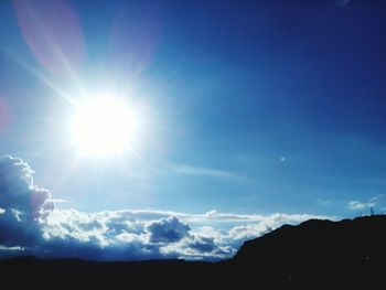 Low angle view of silhouette blue sky