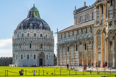 Group of people in front of historical building