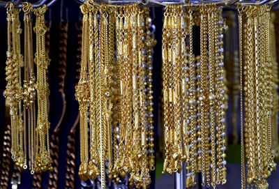 Full frame shot of jewelry hanging in store for sale
