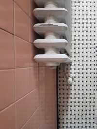 Low angle view of tiled floor against wall at home