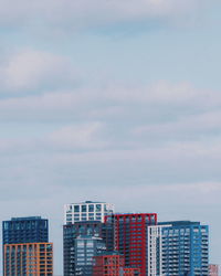 Buildings in city against sky