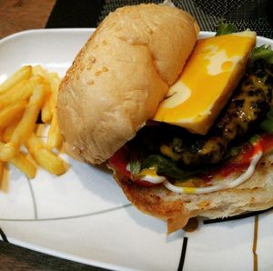 Close-up of burger in plate on table