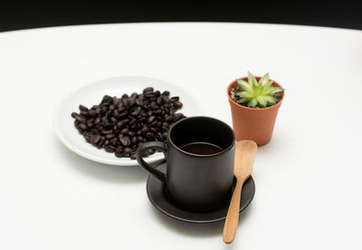 Close-up of coffee cup on table