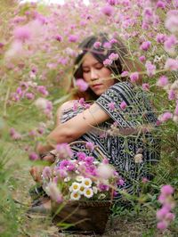 Beautiful woman with pink flower