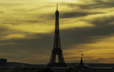Eiffel tower against the sky during sunset
