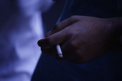 Close-up of man smoking cigarette