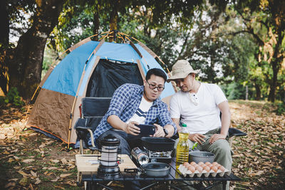 Two best friends go camping and cooking among the nature