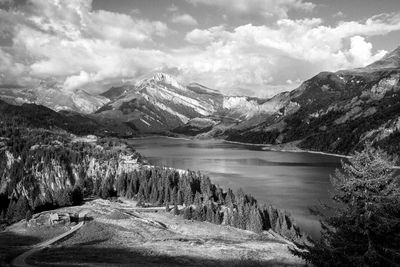 Scenic view of lake and mountains against sky