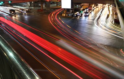 High angle view of light trails on road at night