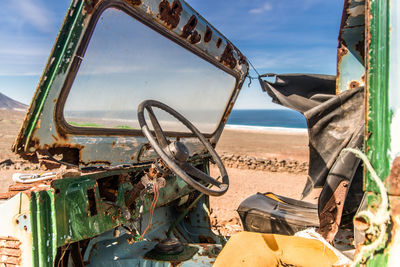 Abandoned vehicle on beach