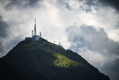 Low angle view of building against cloudy sky