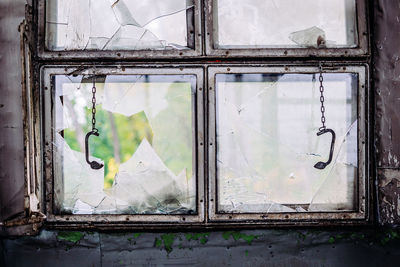 Broken glass window of old abandoned building