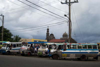Cars on road against sky