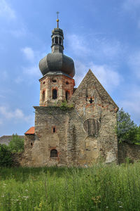 Low angle view of old building against sky