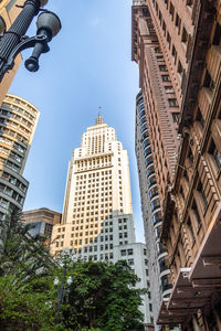 Low angle view of skyscrapers against sky