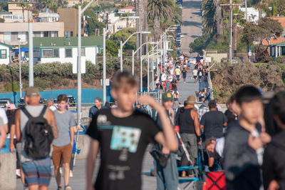 People walking on street in city