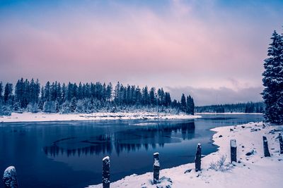 Scenic view of frozen lake against sky during winter