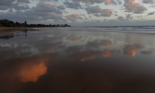 Scenic view of sea against sky at sunset