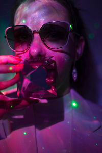 Close-up portrait of man wearing sunglasses