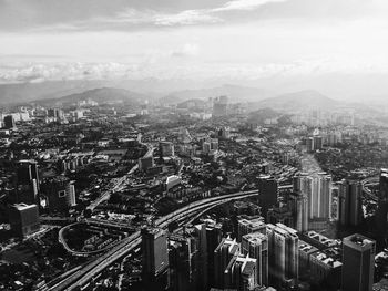 Aerial view of cityscape against sky